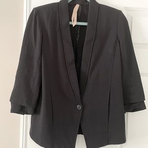 Woman’s black jacket